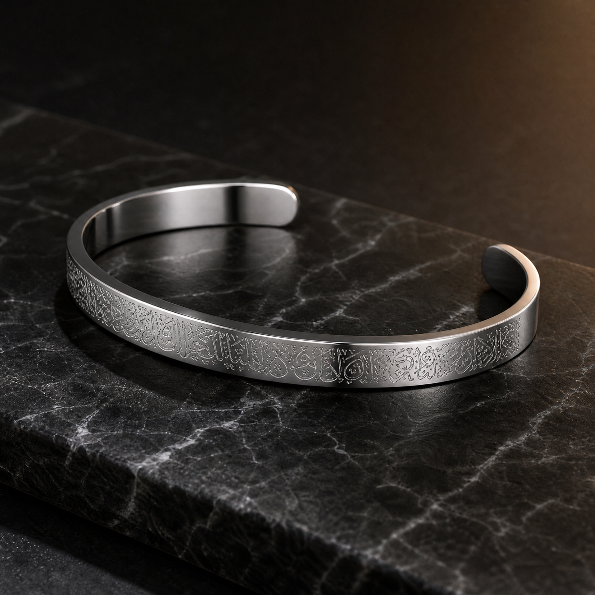 BRACELET AYAT EL KOURSI on dark marble, three-quarter angle