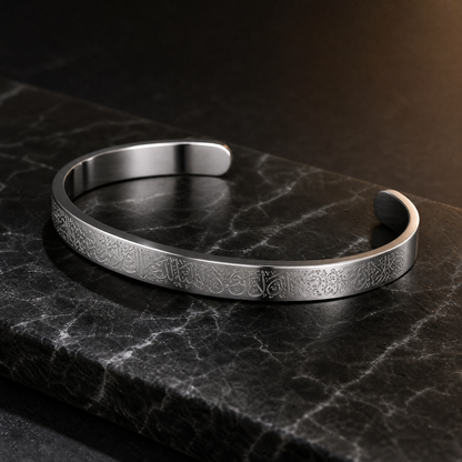 BRACELET AYAT EL KOURSI on dark marble, three-quarter angle