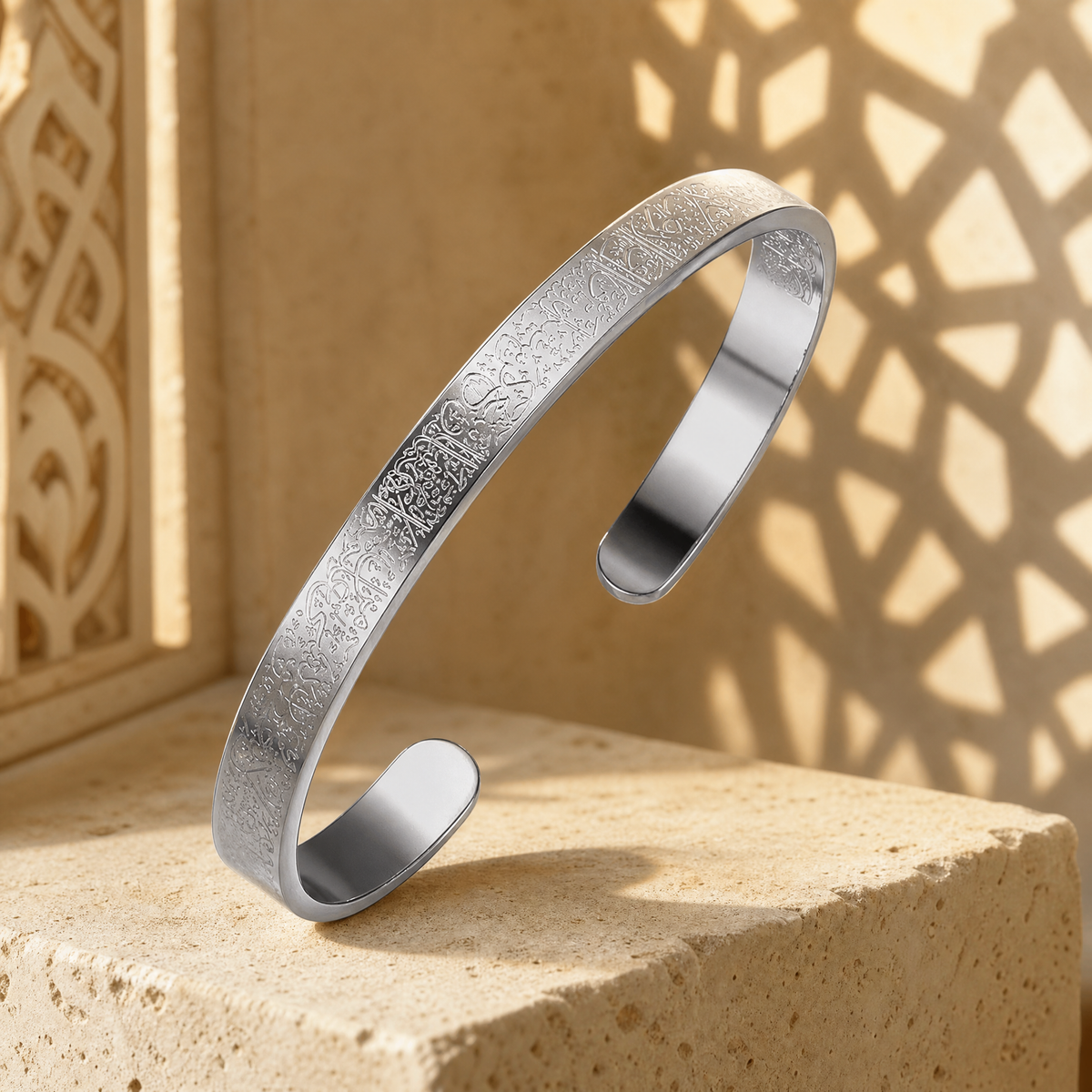 BRACELET AYAT EL KOURSI on stone with carved-screen light behind it