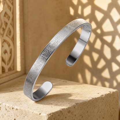 BRACELET AYAT EL KOURSI on stone with carved-screen light behind it